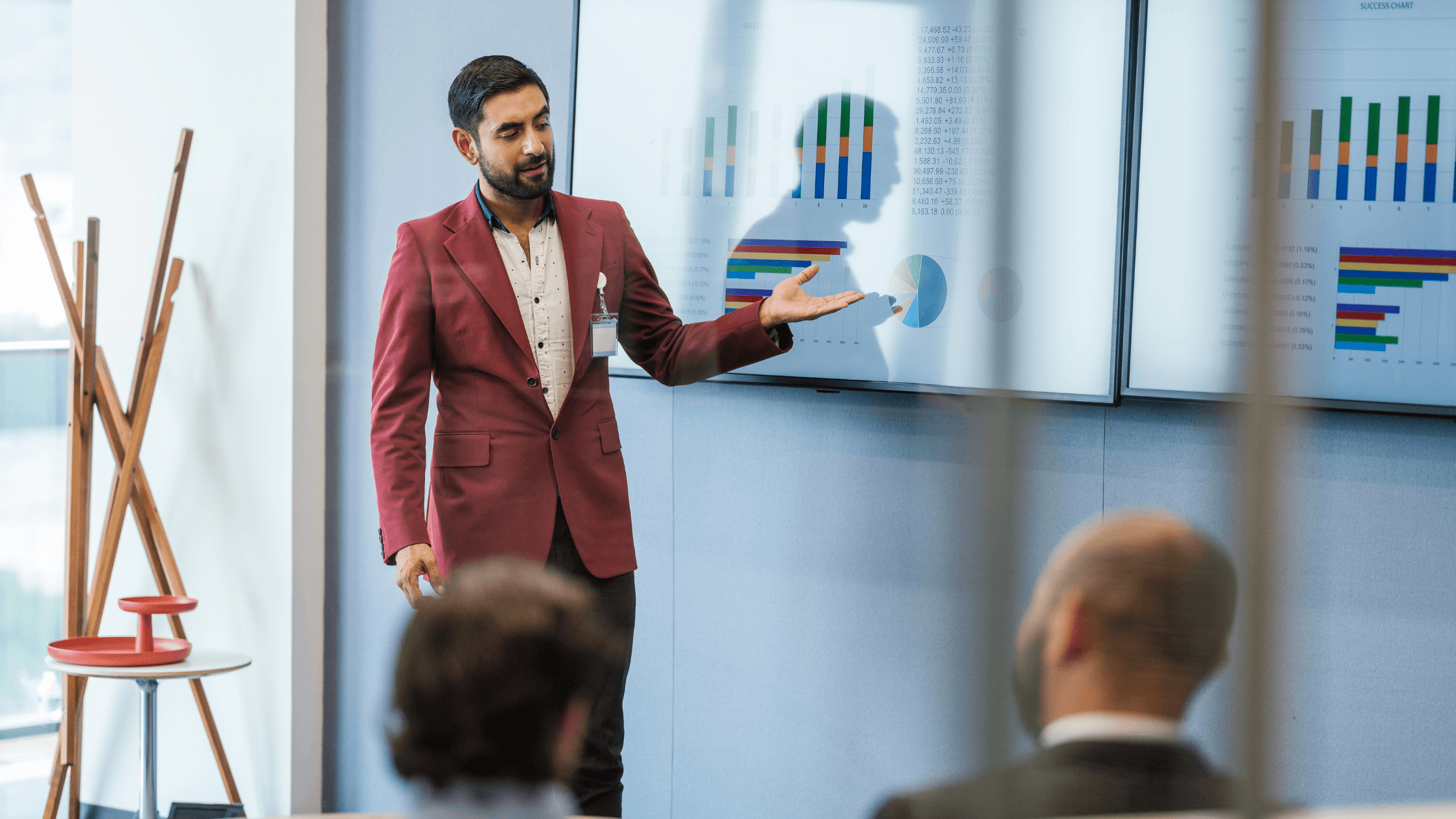 man presents revenue data from CRM to boardroom