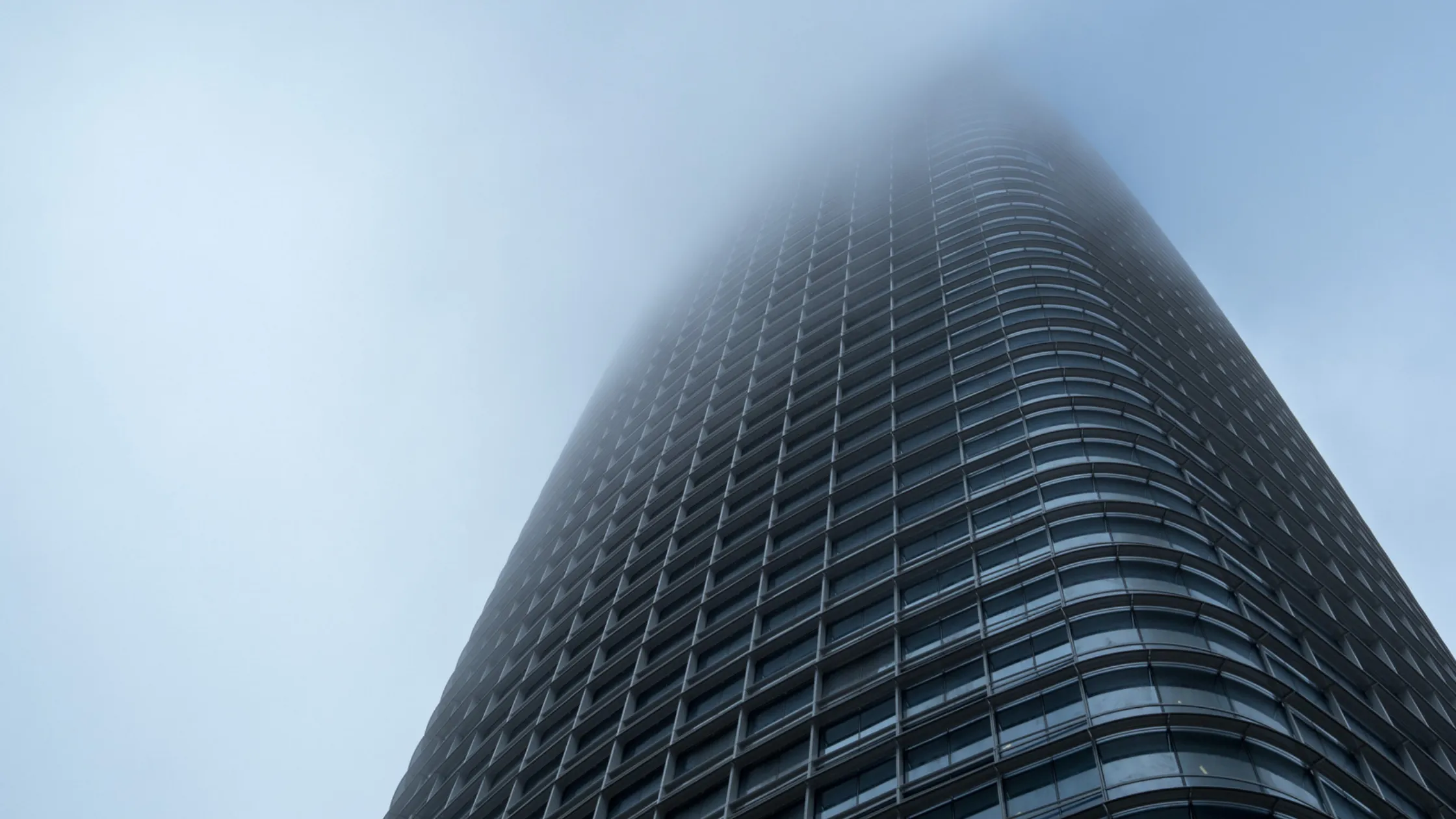 building going into fog